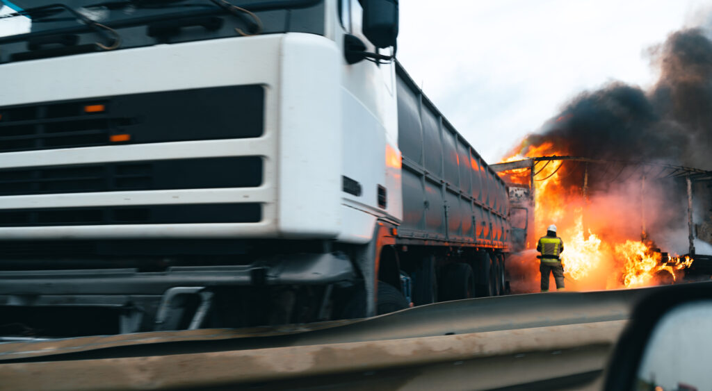 Car crash accident on a highway with damaged automobiles and smoke